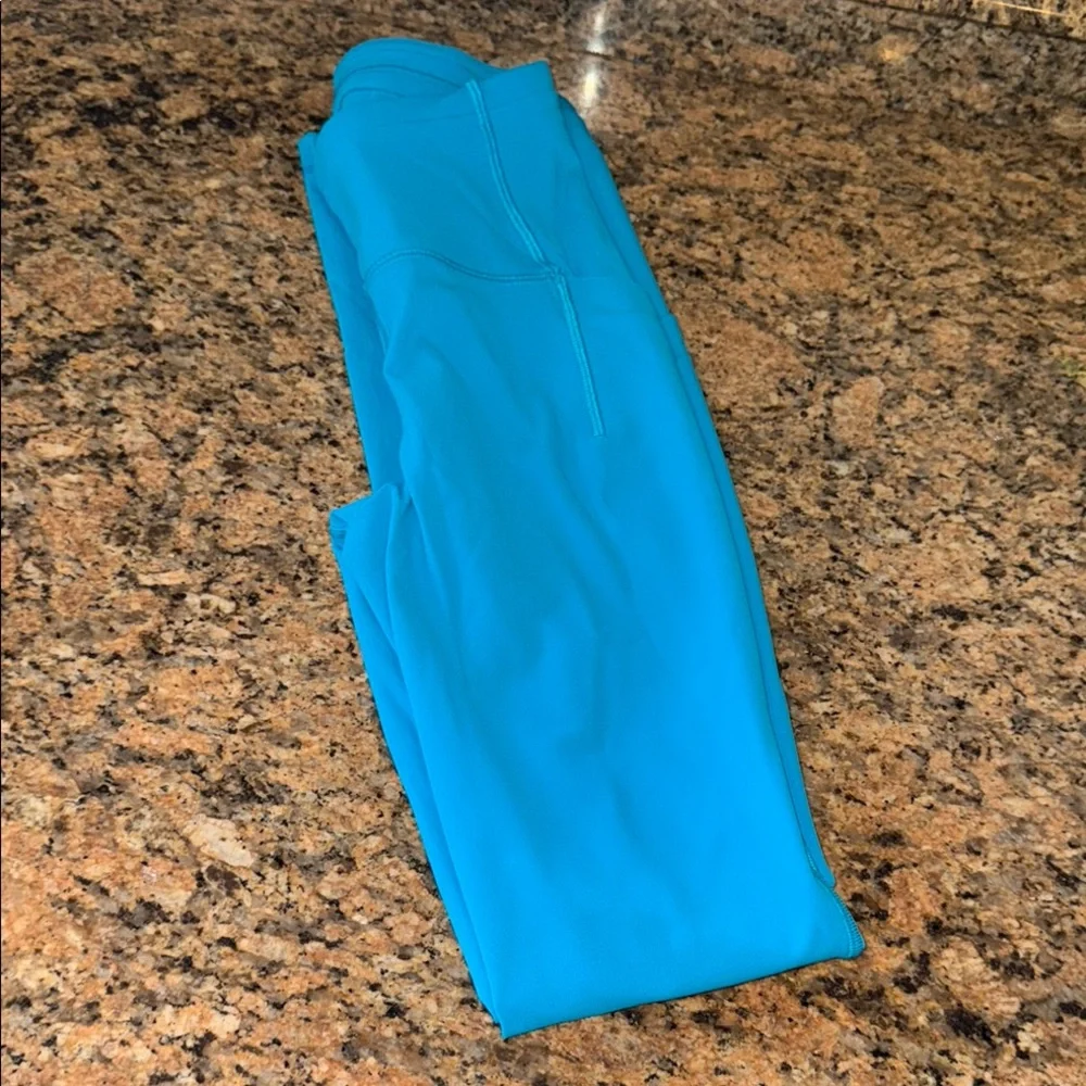 Like New Lululemon Athletica Turquoise Leggings with side pockets - Picture 1 of 8